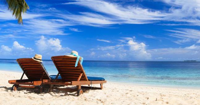 Two beach chairs on the tropical sand beach