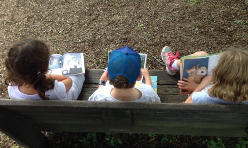 Three kids reading
